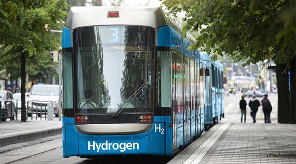 Bill Gates Fund Backs Green Hydrogen | image of bus with sign