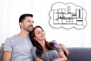 Energy-Efficient Products | Couple contemplating Savings