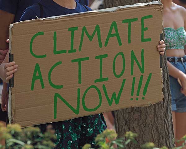 U.S. Climate Ambition Urged Action on Climate Changes | Boy holding sign