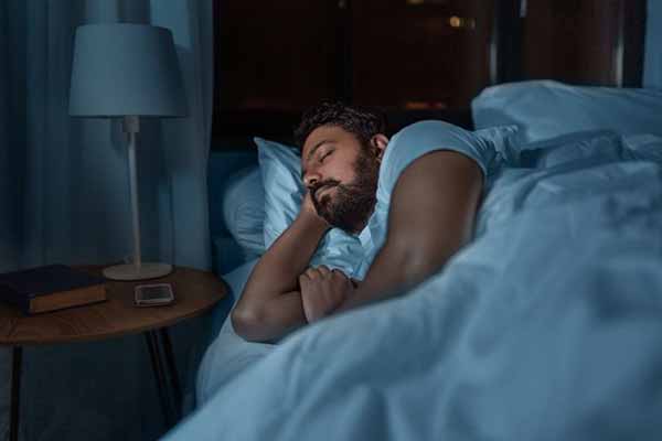 Energy Saving Thermostats at Night | Man Sleeping Comfortably