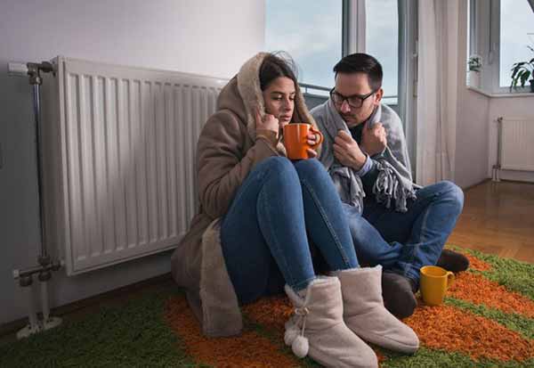UK Energy Bills Effect | Couple in Front of Heater