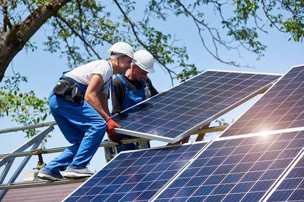 Solar Panels Men Installing Panels on House Roof