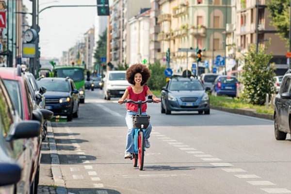 Sustainable Transport Woman Smiles on Bike