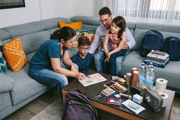 Family with Prepping Materials for Blackout Emergency
